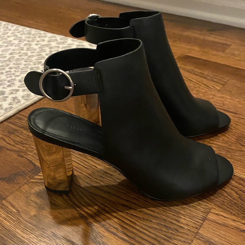 Open toe leather booties with metallic heel. Great preloved condition.